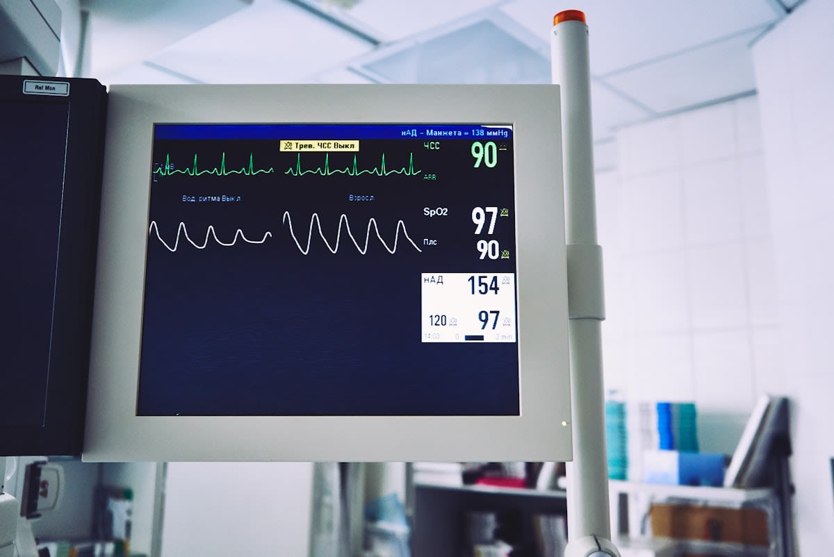 Modern hospital emergency room with digital monitoring screens