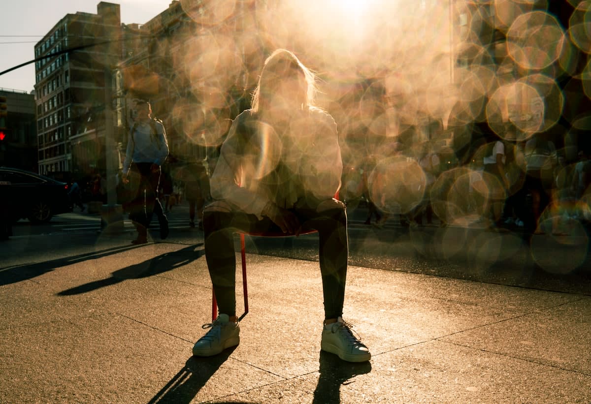 A person taking a deep breath in a high-pressure urban environment
