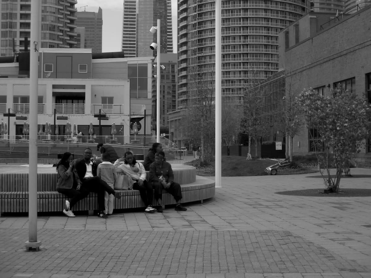 Diverse group of people talking in a modern urban setting