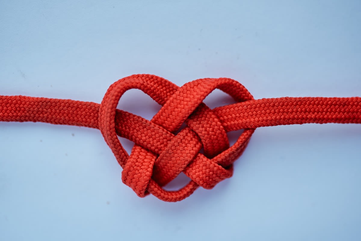 A complex knot being slowly untied
