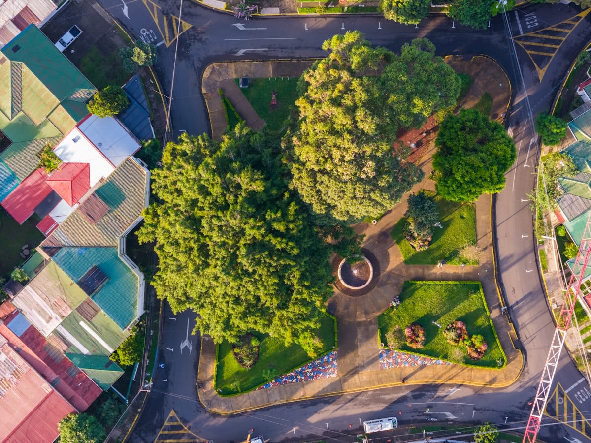 aerial view of a modern city with green pockets