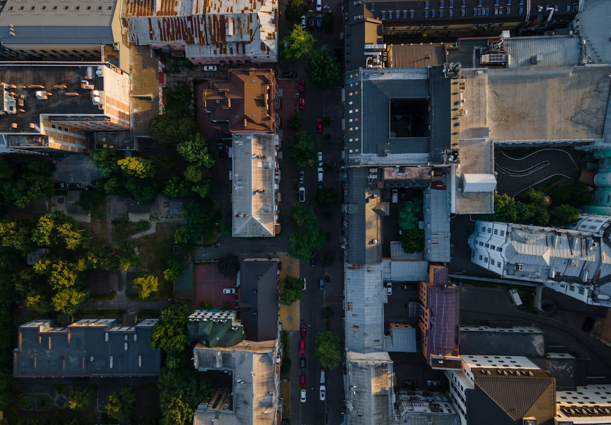 Aerial view of a dense urban center with a mix of old and new architecture