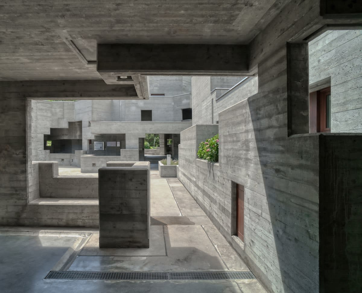 Brutalist architecture with raw concrete and irregular shapes