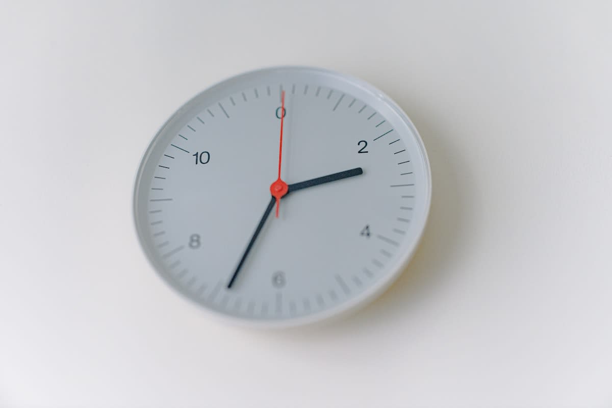 Minimalist clock on a white wall