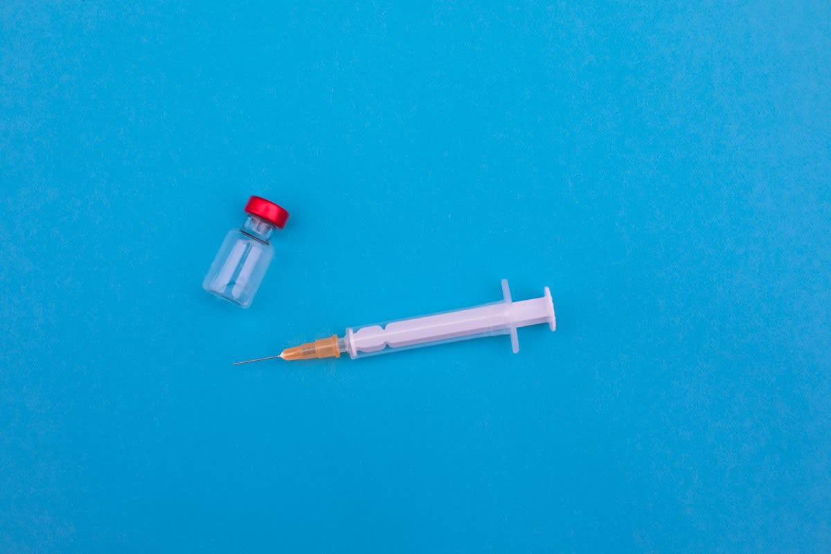 Close up of a medical vial and syringe