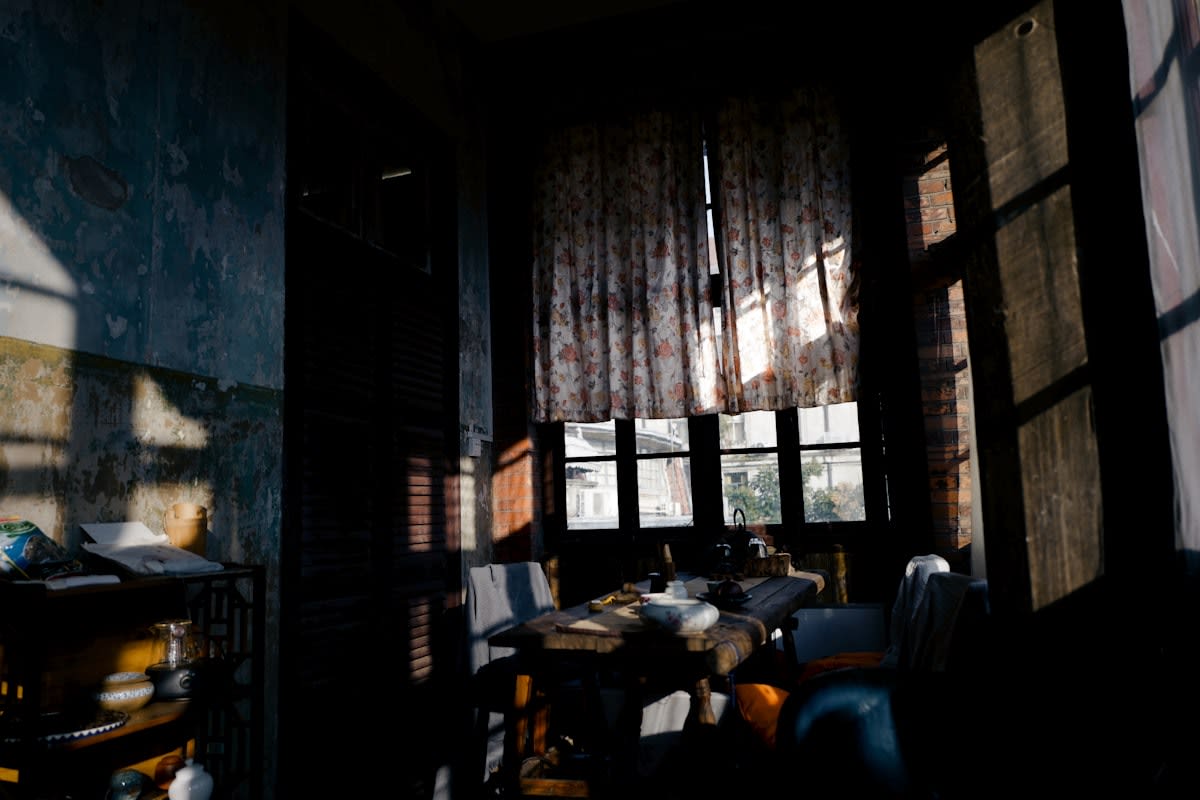 Old dusty library with sunlight streaming through windows