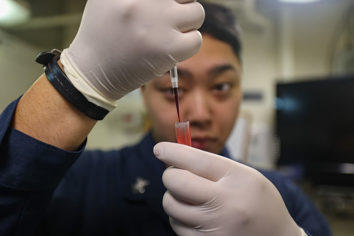 Close up of a blood sample vial in a high tech medical laboratory