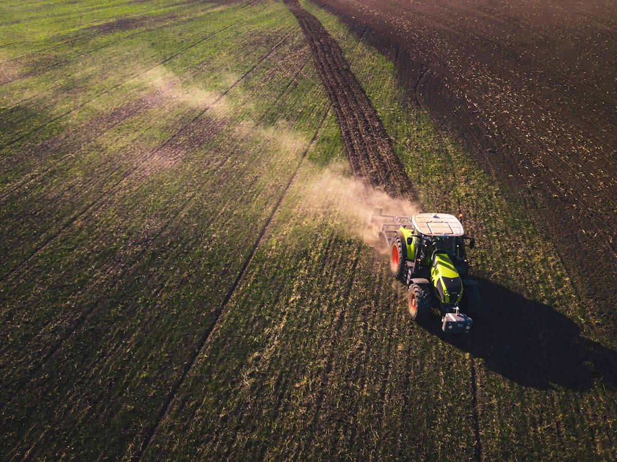 Modern tractor using variable rate application technology in a field