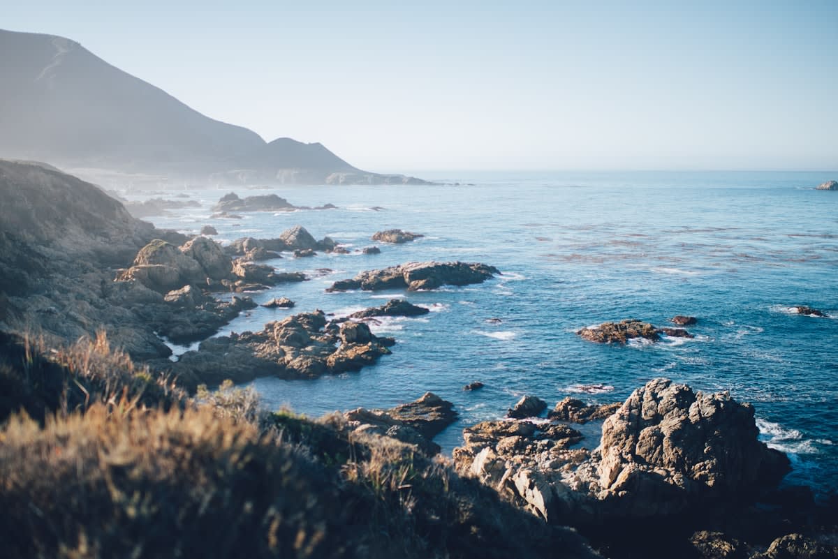 Ocean tide shoreline with rocks