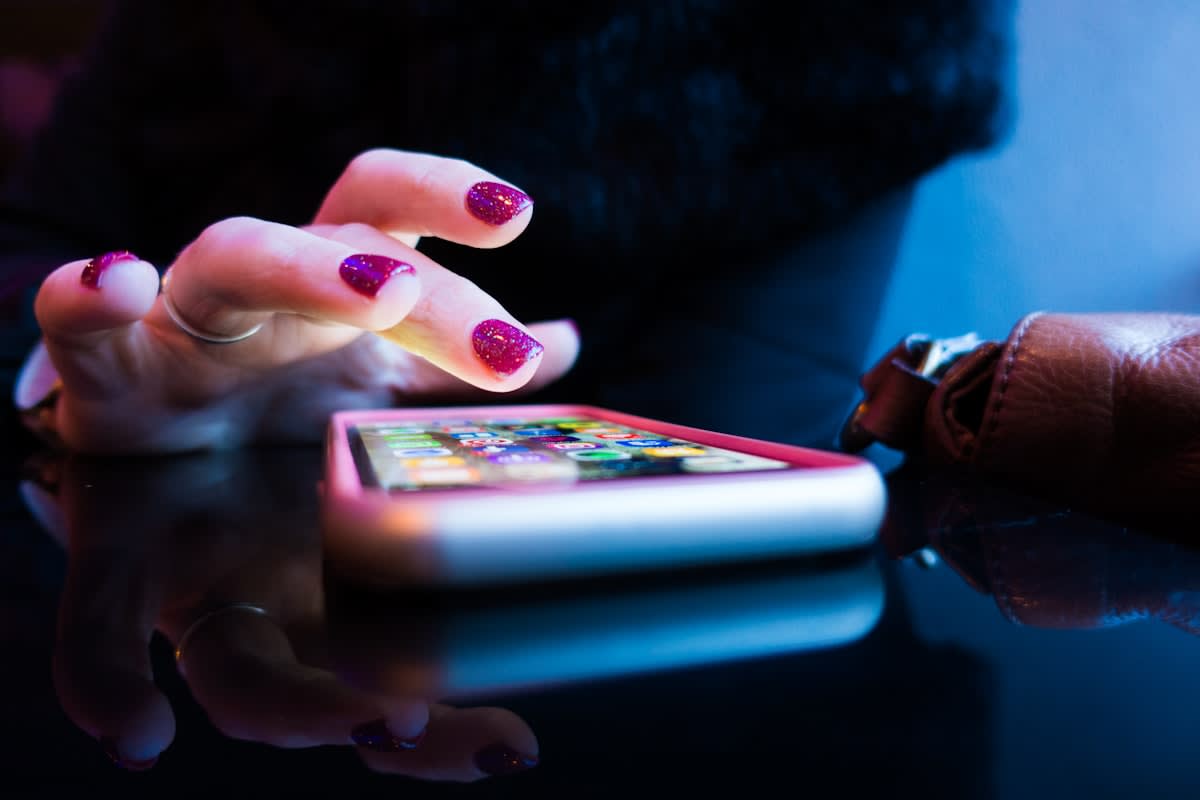 Gen Z using smartphone in a luxury setting