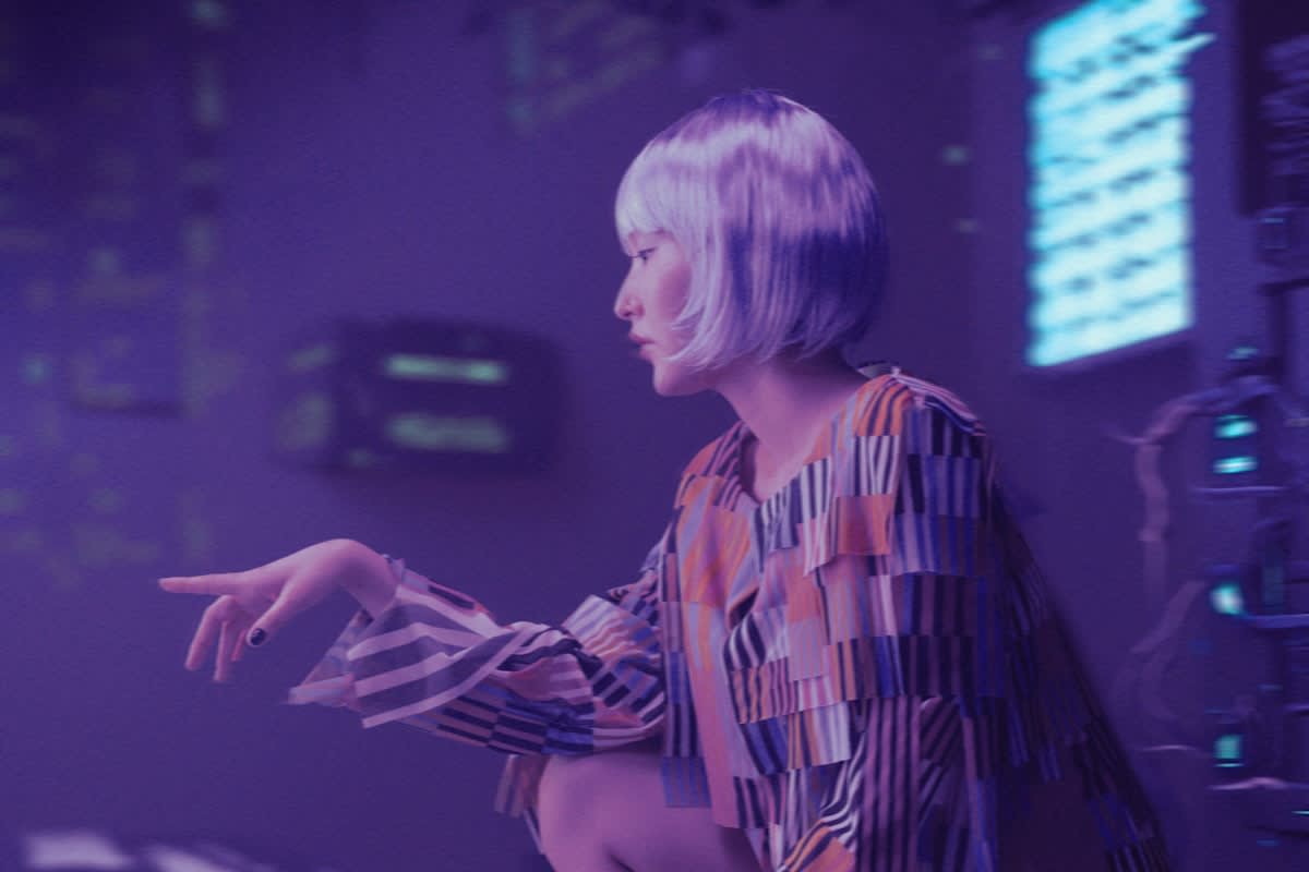 A professional looking at a futuristic interface of data and human connections