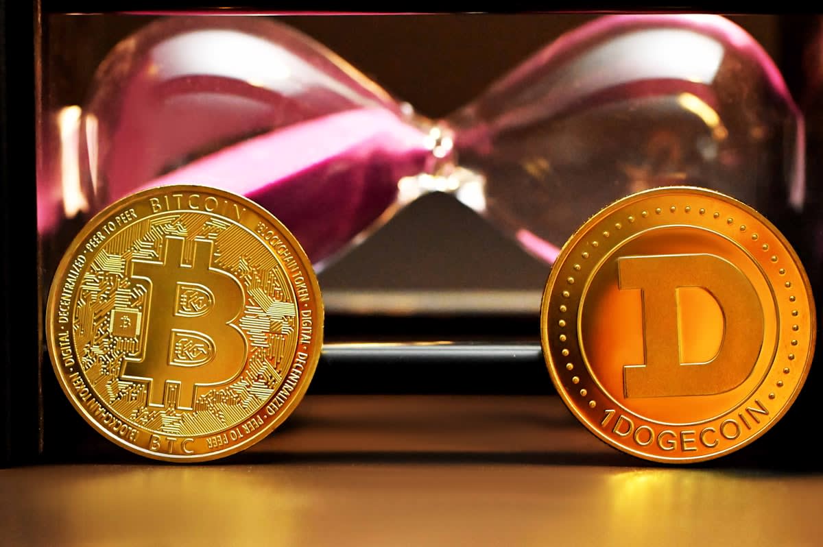 an hourglass with gold coins instead of sand