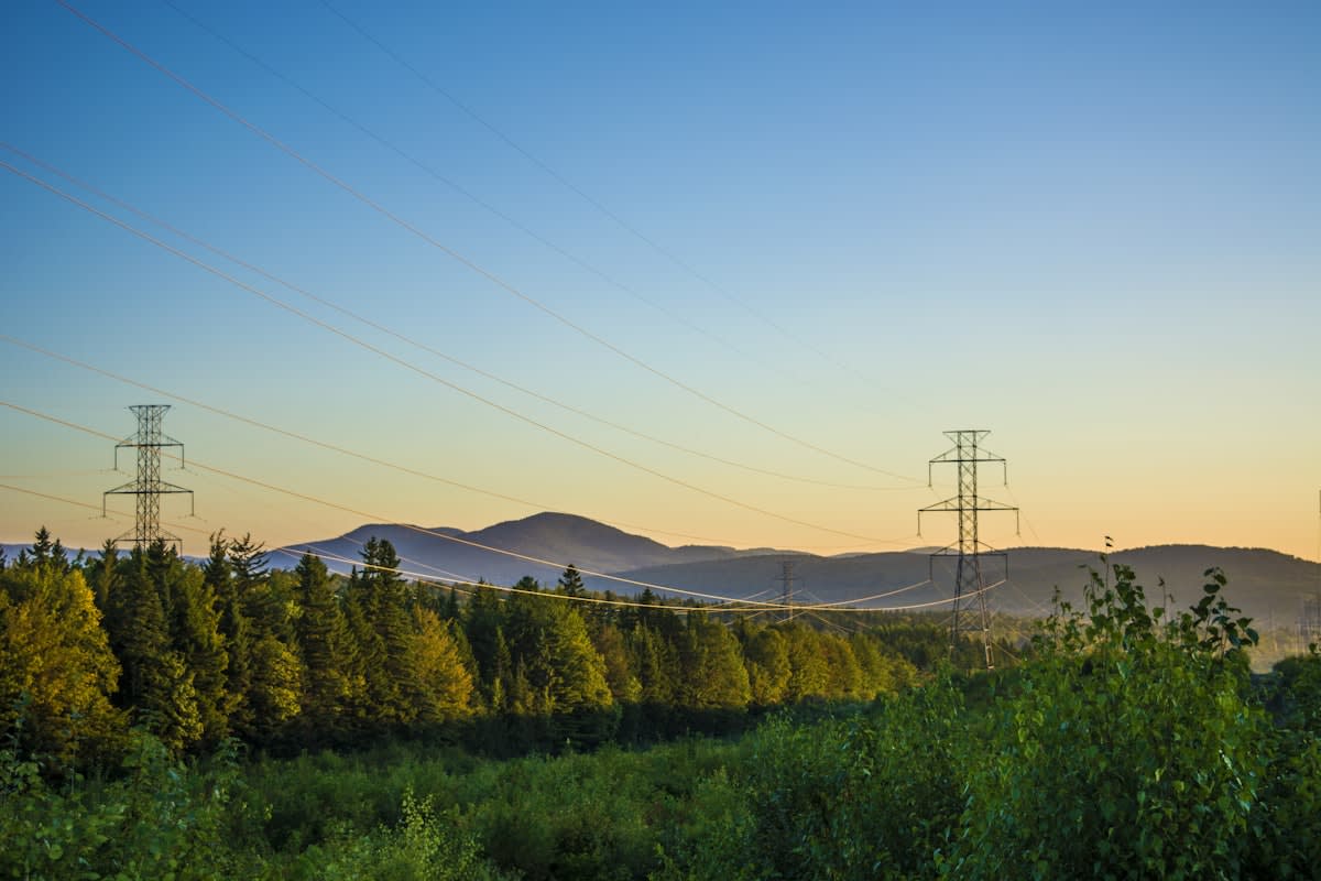 High voltage power lines stretching across a landscape