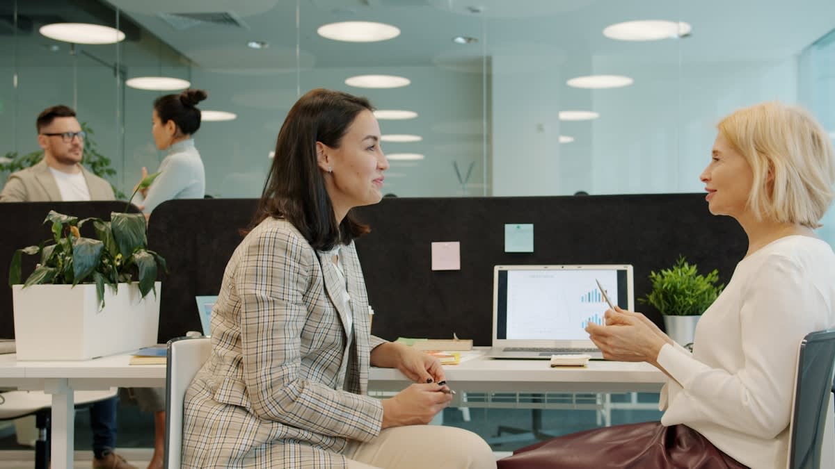 A diverse group of professionals in a heated but respectful debate in a modern office