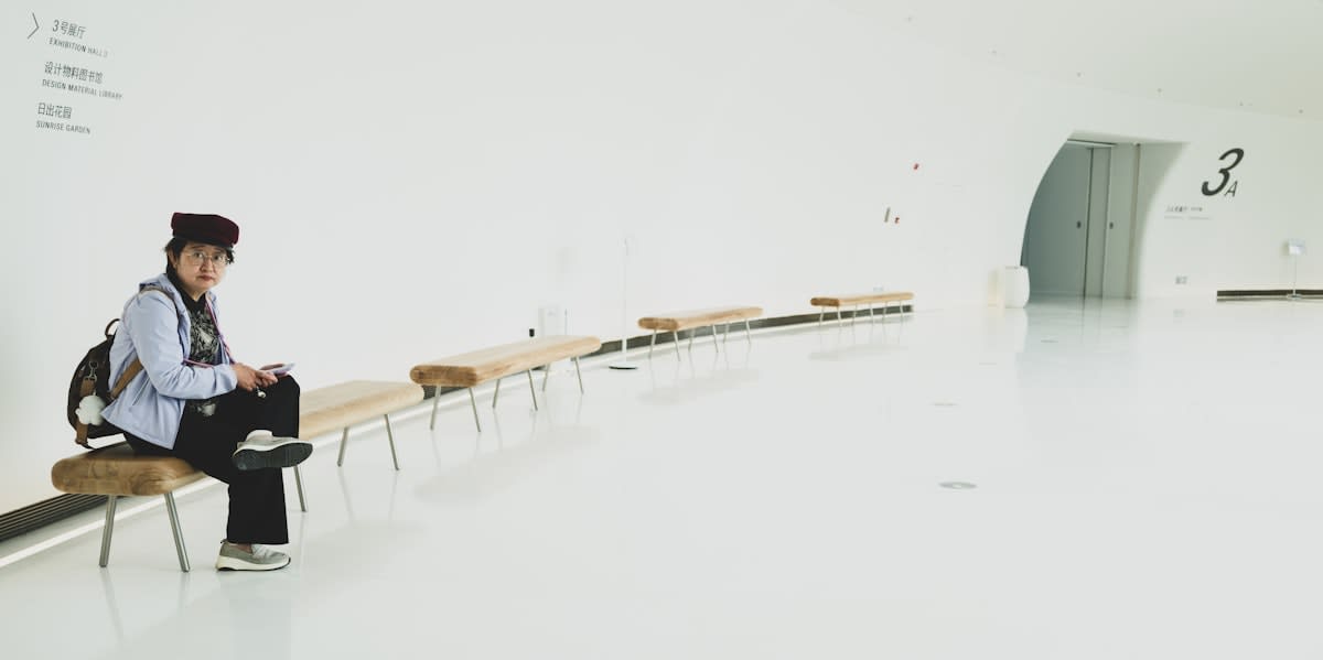 Person meditating in a modern, minimalist space