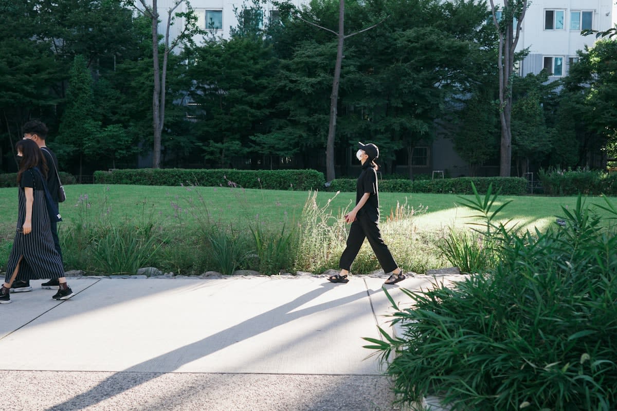 Person walking in a city park after lunch