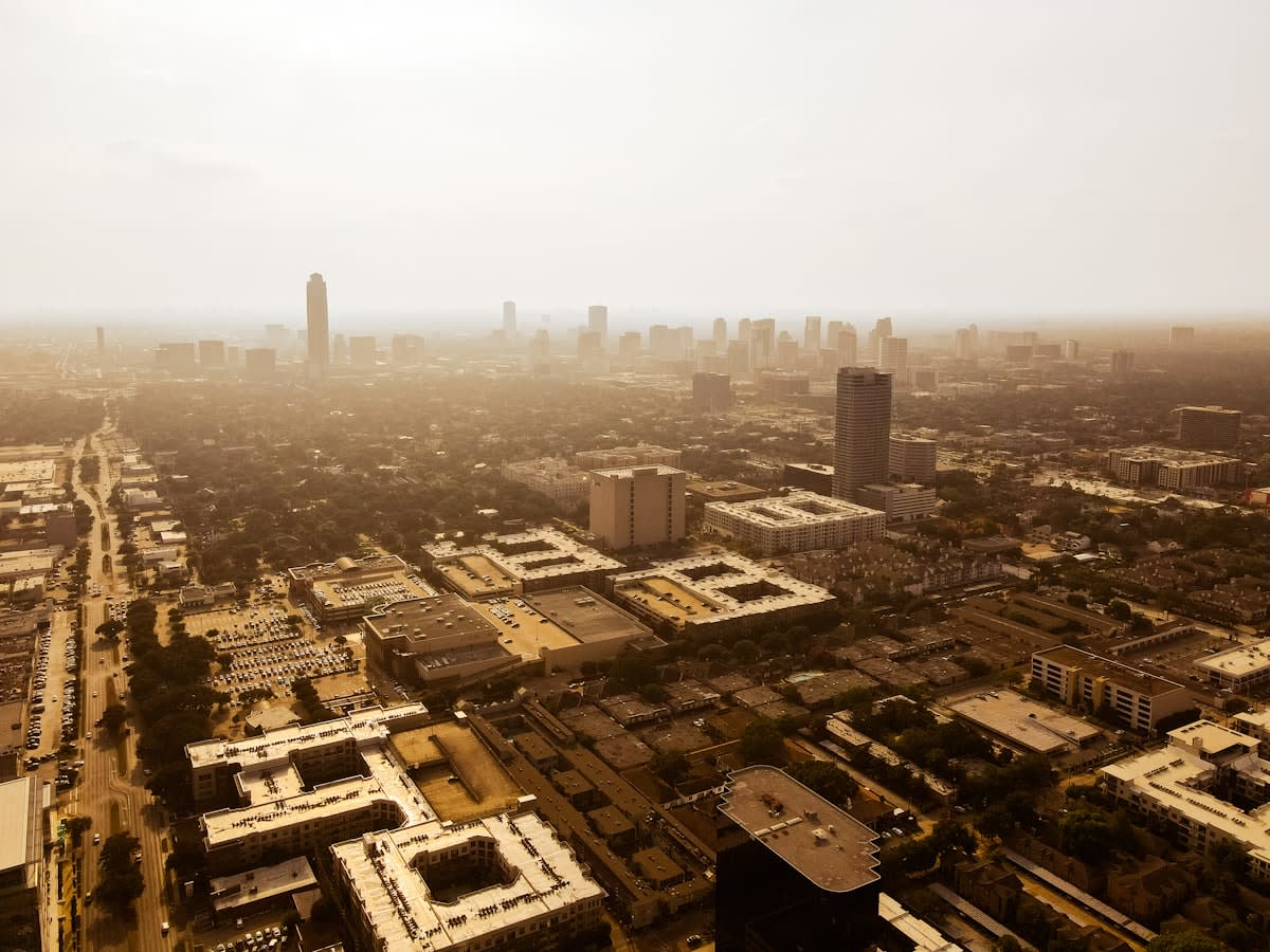 Aerial view of a dense city with heat haze