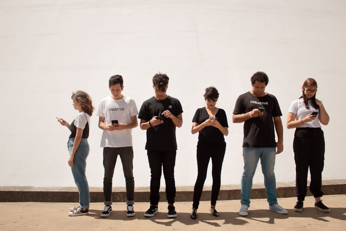 Diverse group of people communicating via digital screens