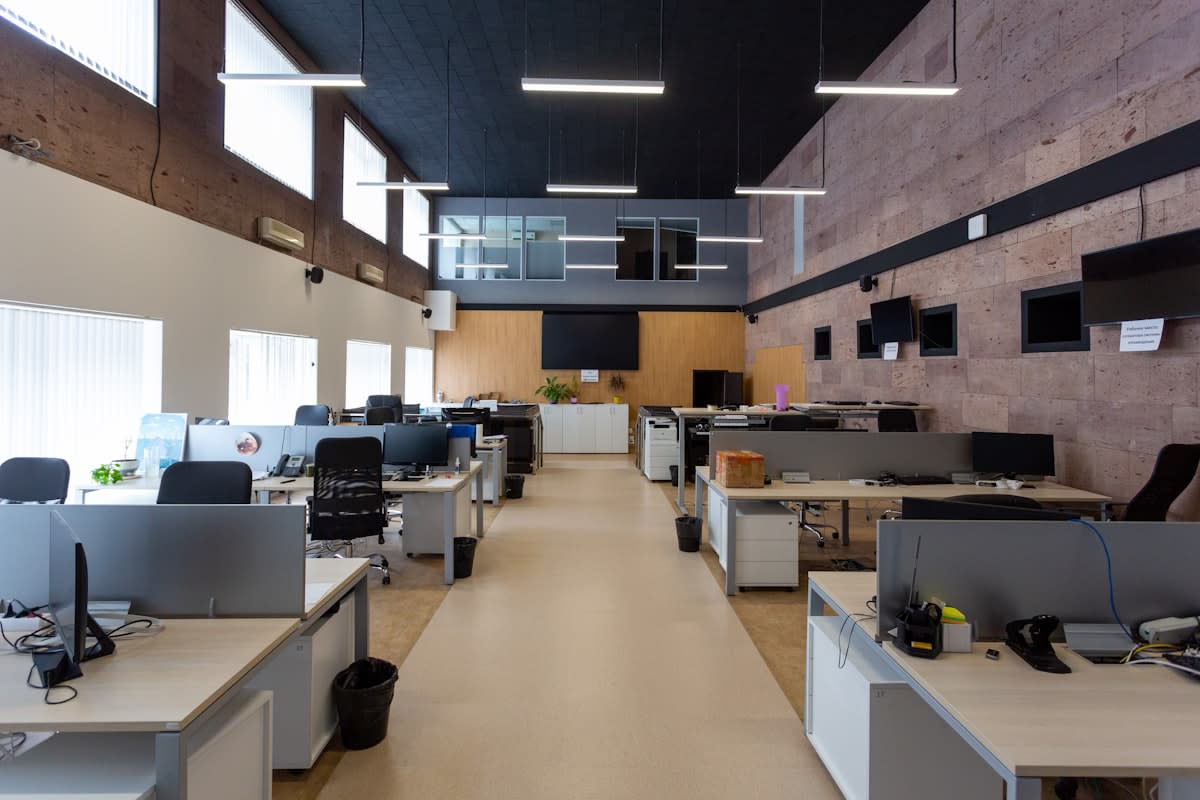 Contrast between a 1950s office and a modern open-plan workspace