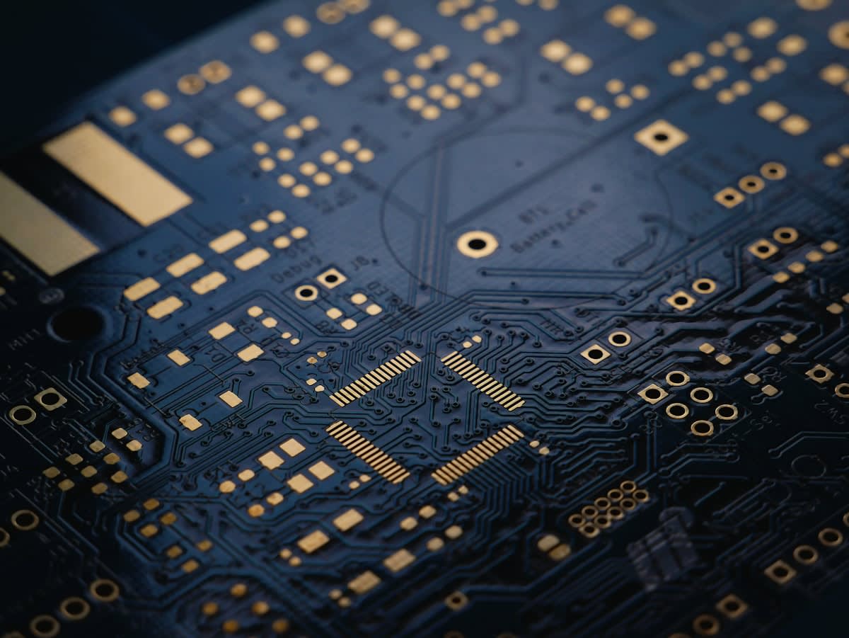 Close up of a circuit board being modified