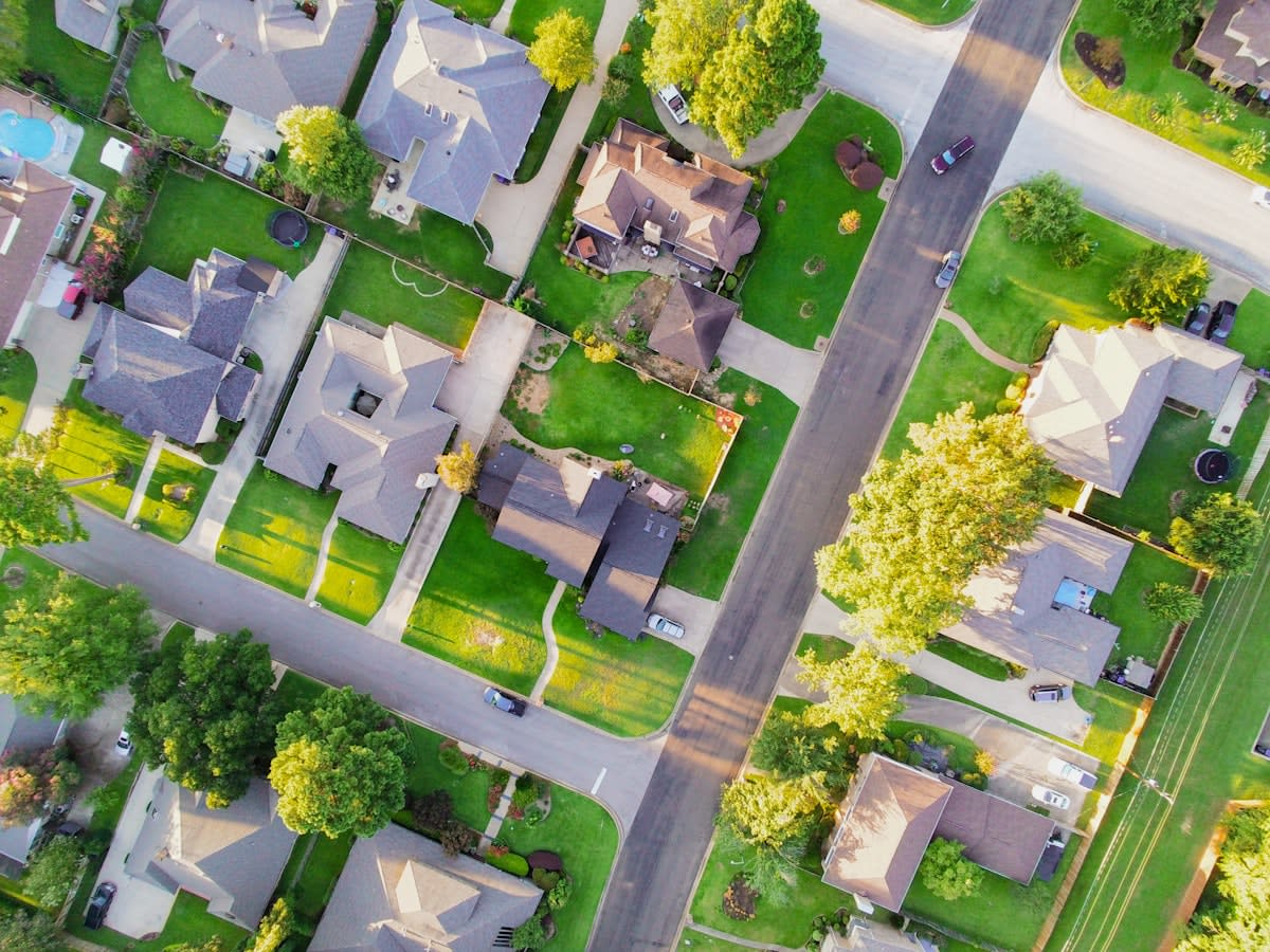 Aerial view of an urban neighborhood with connected green spaces