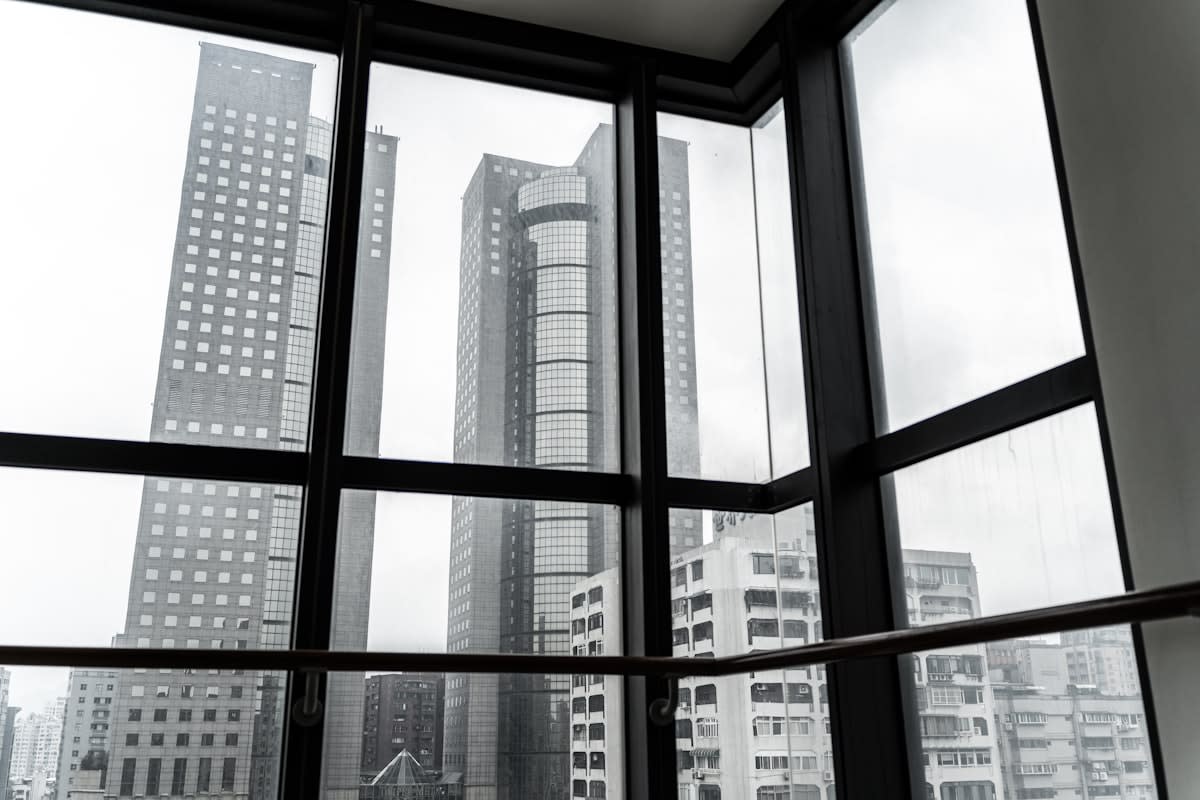 High-rise office window overlooking a global city