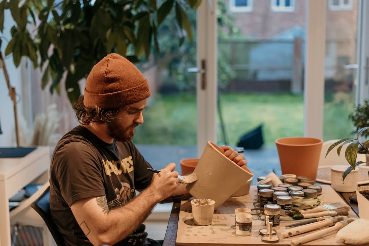 a person engaged in a mindful hobby like gardening or pottery