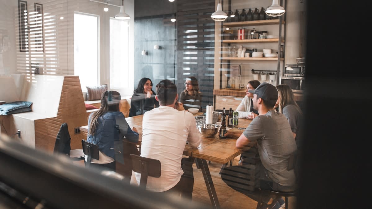 A diverse group of people in a circular discussion