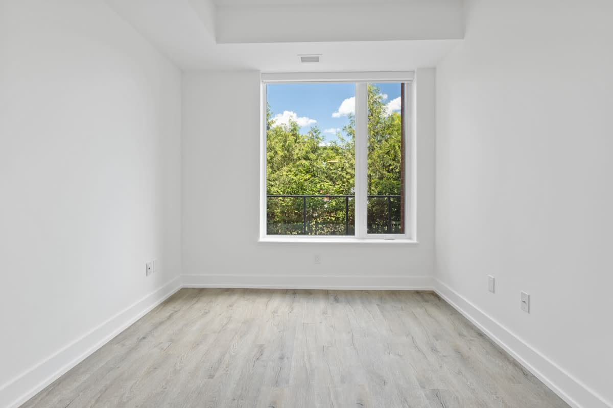 Minimalist empty room with a single shaft of light