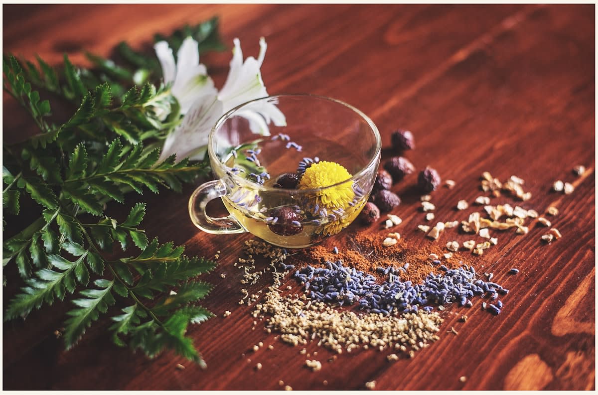 Close up of a complex botanical drink with herbs and spices
