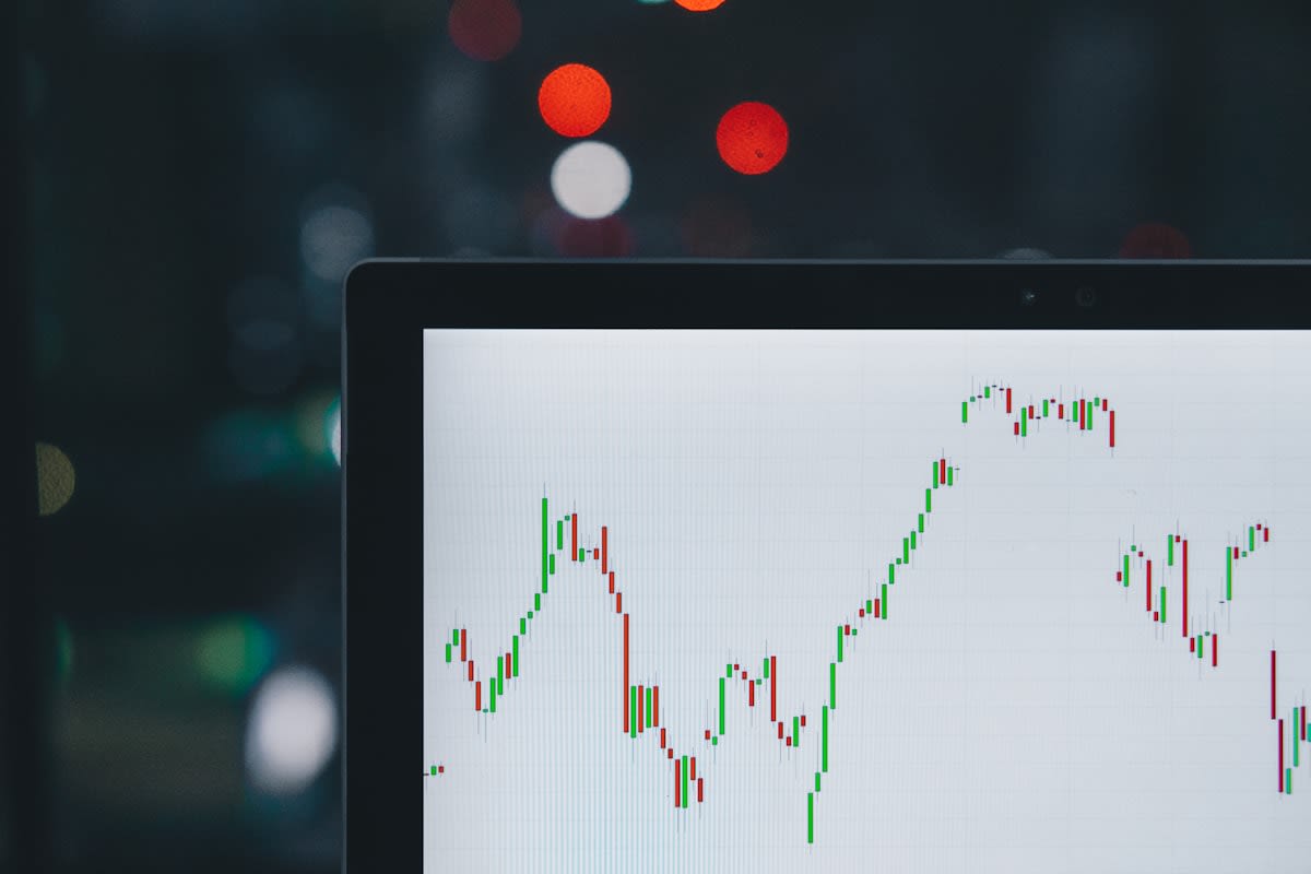 Close up of digital code and financial charts