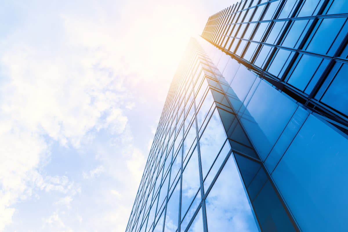 Modern glass skyscrapers reflecting sunlight