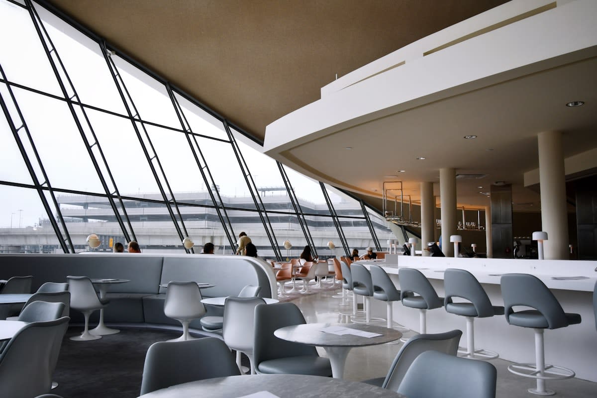 Modern airport lounge with diverse professionals