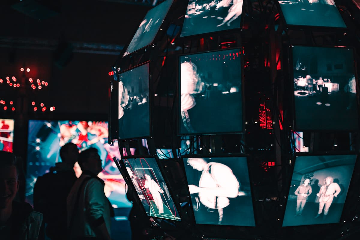 Person overwhelmed by screens