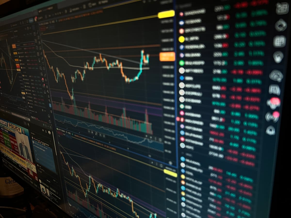 a high-tech trading floor with multiple screens showing probability charts