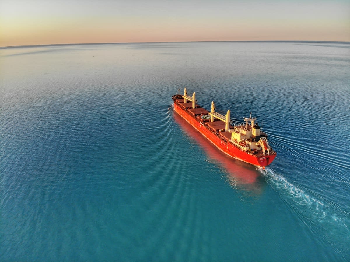 modern cargo ship with rotor sails