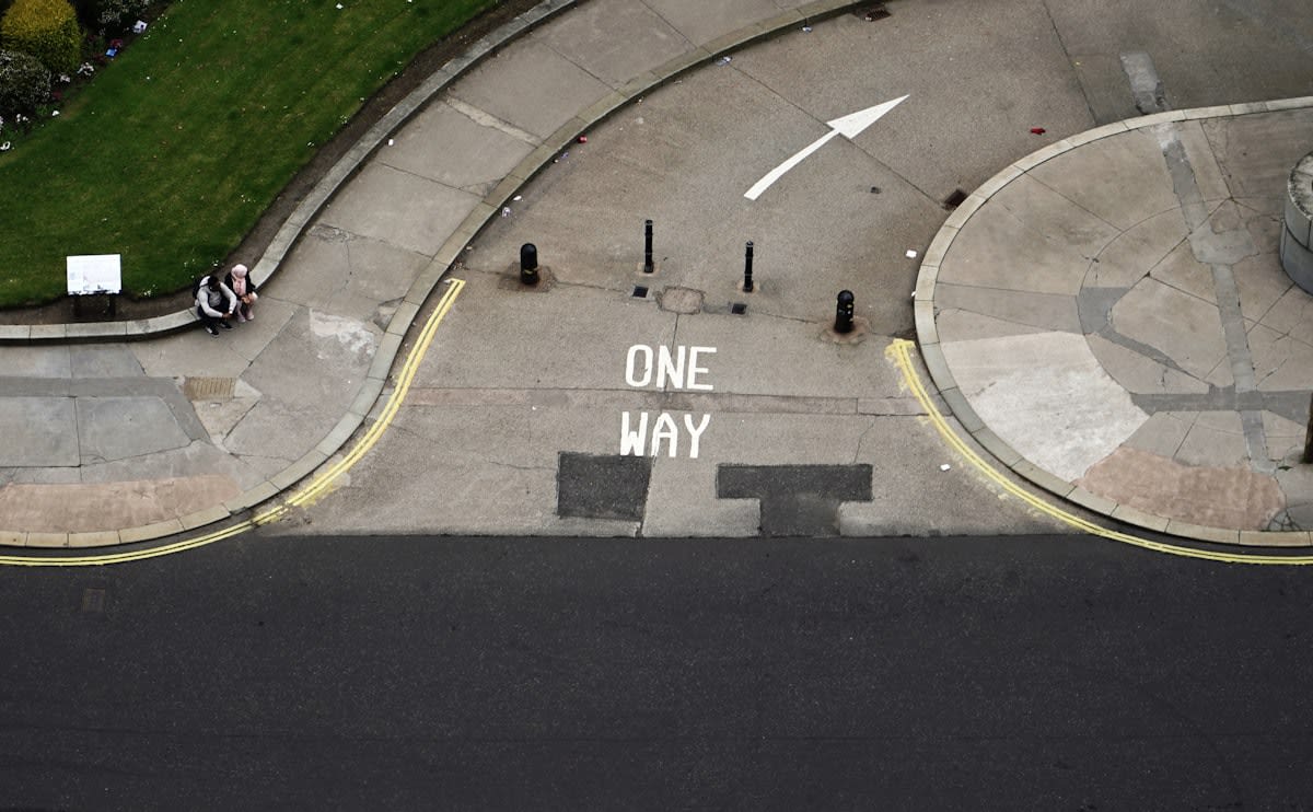 Abstract visualization of a crowd moving in one direction with one person facing the opposite way