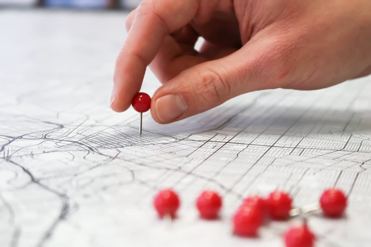 Person analyzing a complex map