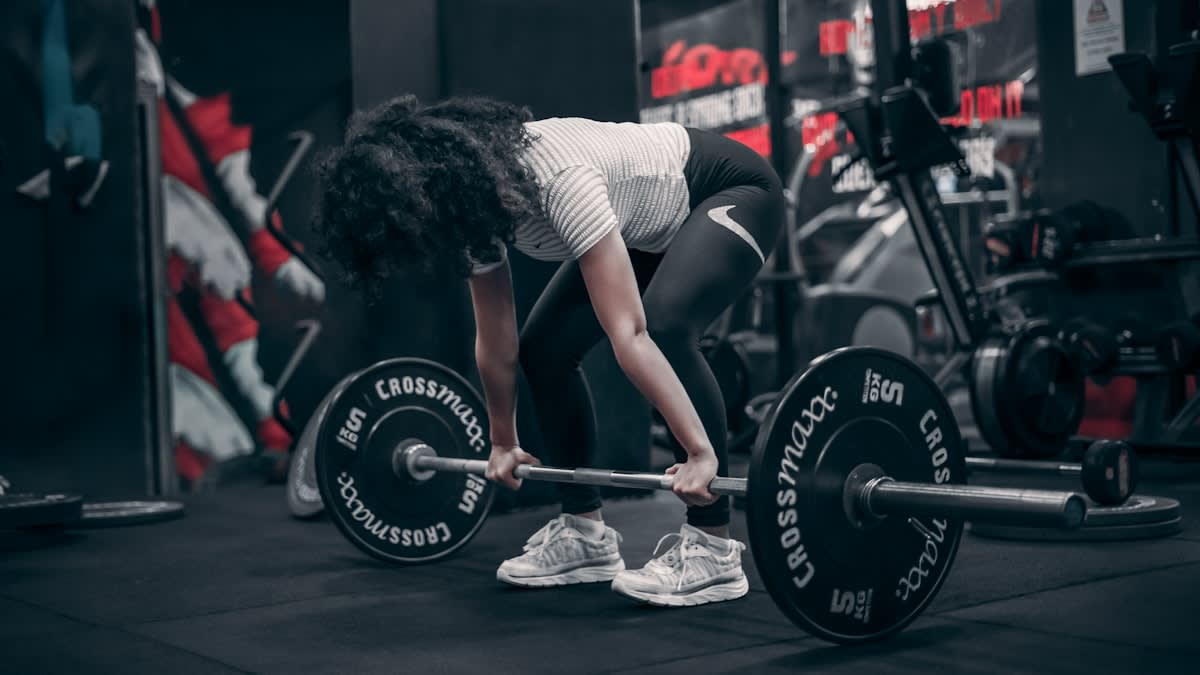 Athlete performing diverse movements in a gym