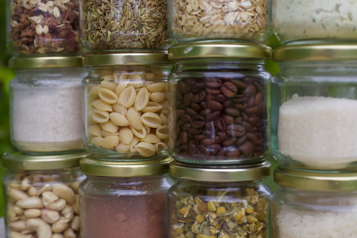 Minimalist organized bulk pantry with glass jars and labels