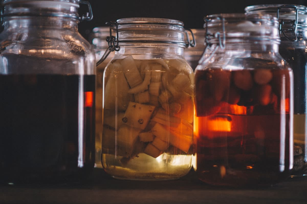 Close up of fermented vegetables in glass jars