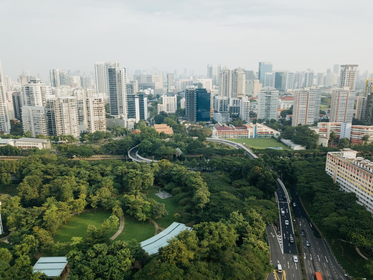 Aerial view of a dense metropolis with green patches