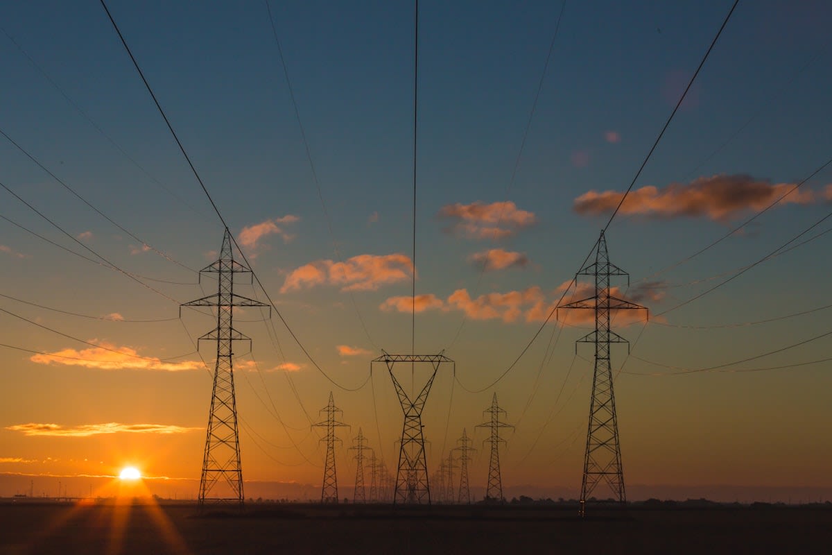 High voltage power lines crossing a landscape