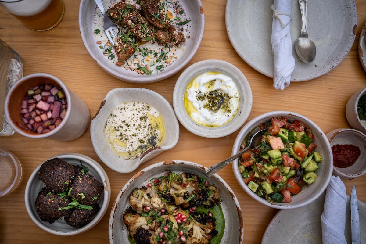 Various global dishes including a Mediterranean salad and Asian stir fry