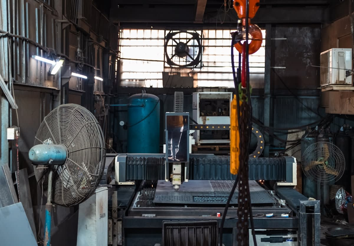 Vintage industrial clock in a factory setting