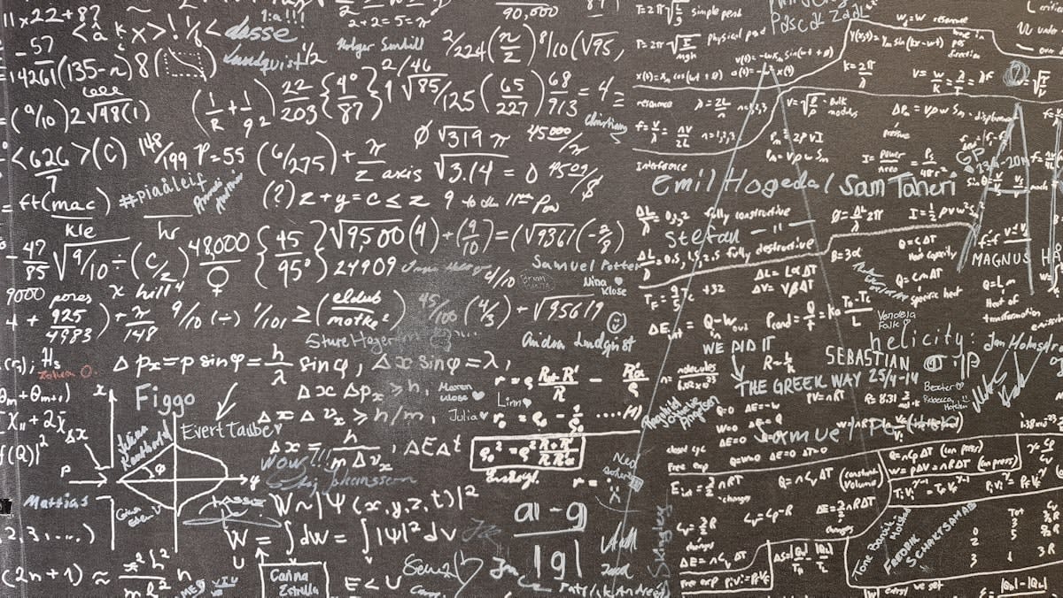 complex mathematical equations on a chalkboard