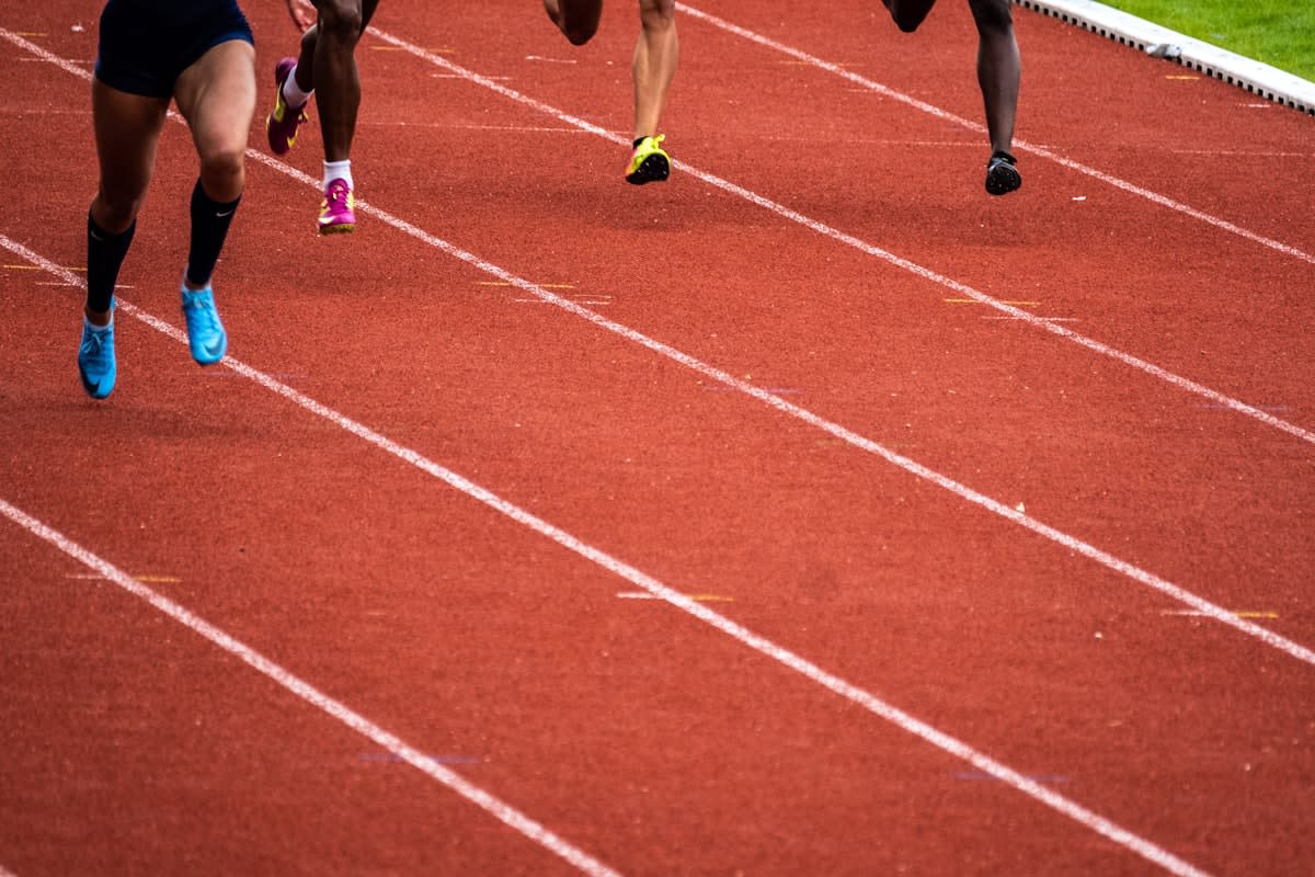 Athlete performing high intensity intervals on a track