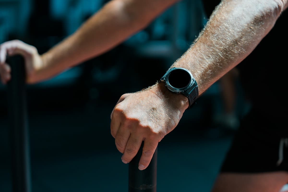 Close up of an athlete wearing a high-tech fitness tracker on their wrist