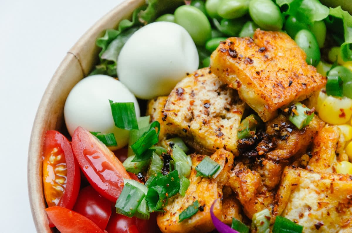 High protein food variety including fish, tofu, eggs, and legumes