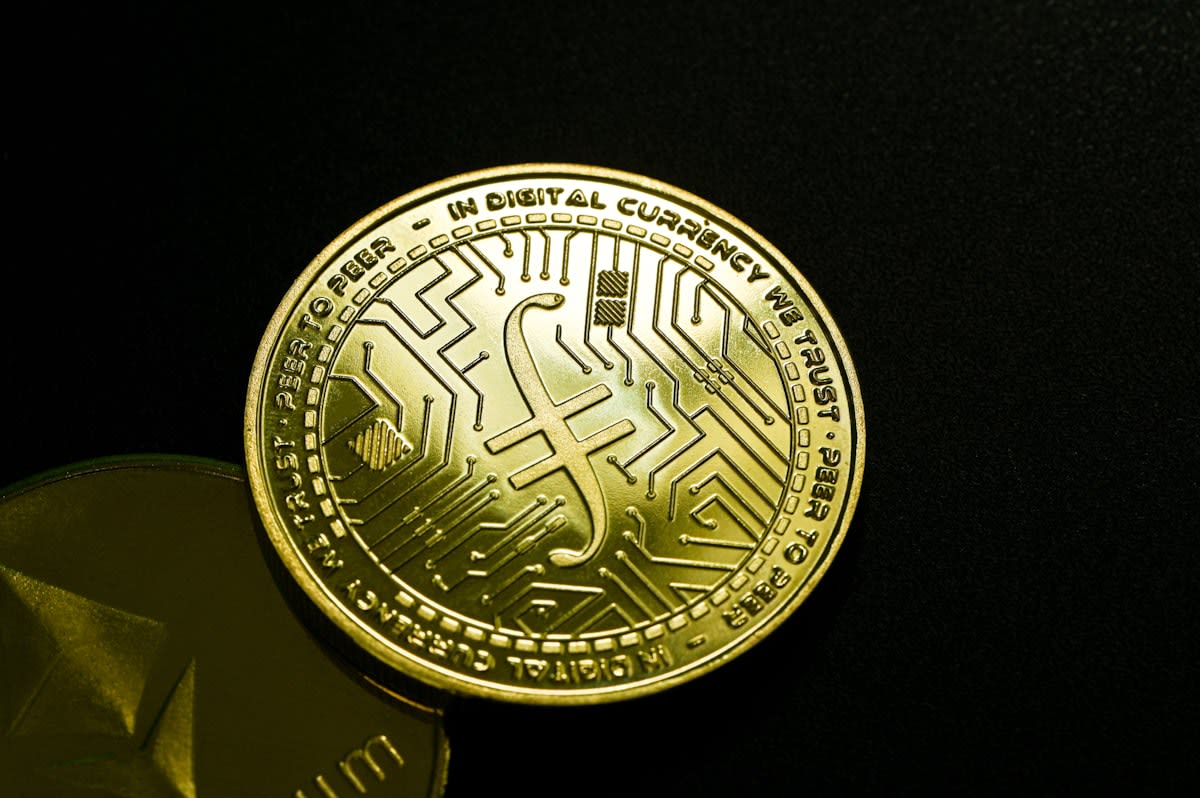 Close up of digital gold coins and circuitry